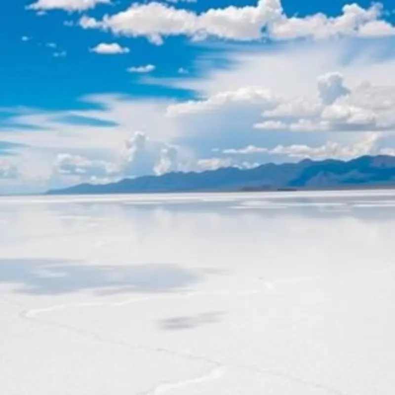 Mediterranean salt flats gleam under the sunny skies, reflecting local traditions.